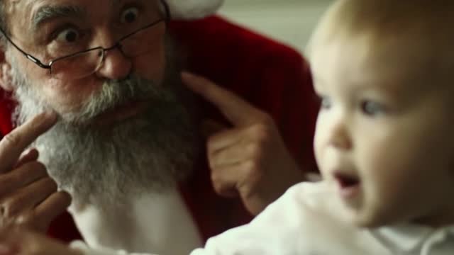 Santa Claus With A Baby