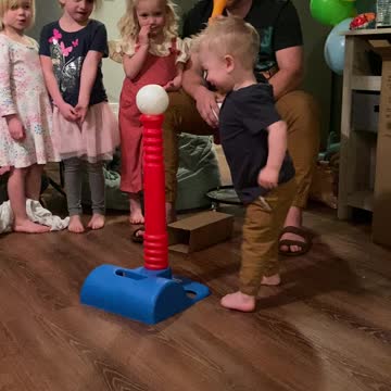 2 yr old has a unique way of hitting the ball