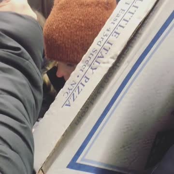 Pizza box subway being held sideways