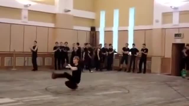 Russian guy squat kick dancing insanely fast