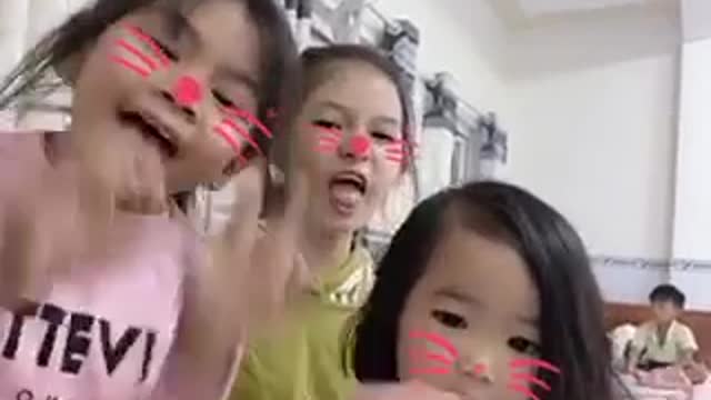 Three girls are cats