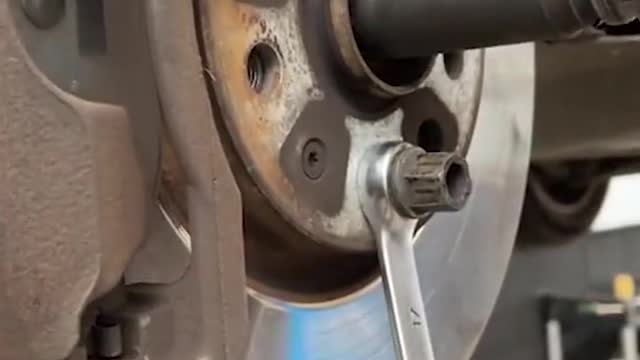 Remove large nut to secure brake disc