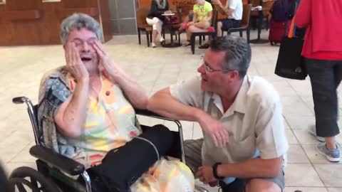 "Old Lady Slaps Her Son When He Surprises Her With a Visit"