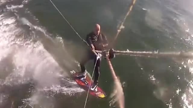 Scary moment while surfing whale jump across