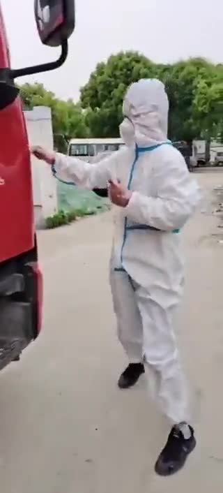 Giving a covid test to a truck