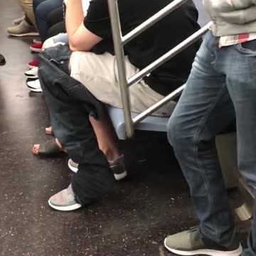 Guy khaki shorts wearing jeans at his knees