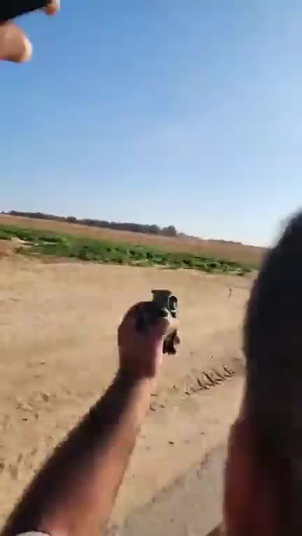 A CNN freelance Journalist carries a hand grenade at the Israeli border area during Hamas attack On Oct 7, 2023