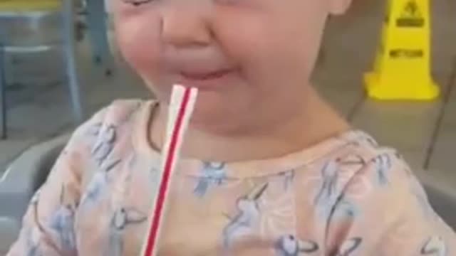 Cute baby drink soda, her reaction