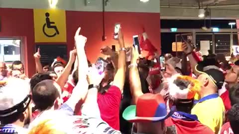 Arsenal football fans in the stadium at 1/4 final game of Champions League