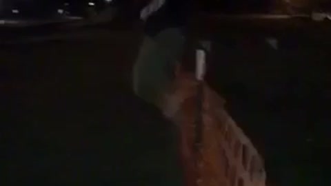 Guy jumps over orange fence fail