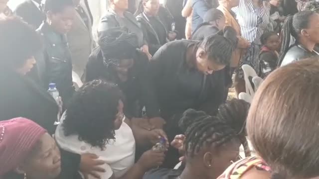 Funeral: Mourner weeps