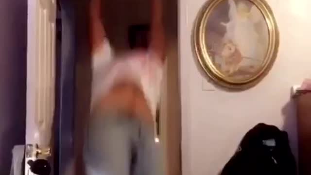 Guy white shirt off with your head runs and jumps into door