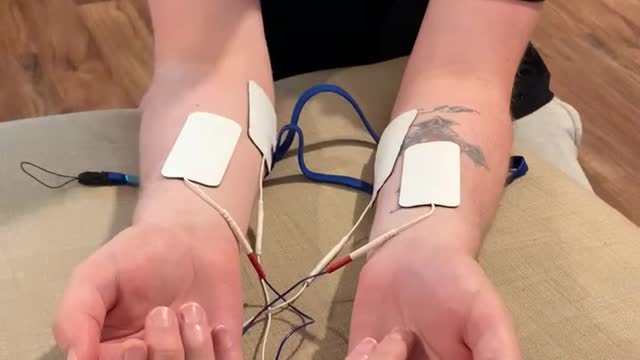 Man Tests Out Tens Machine for Pregnant Partner