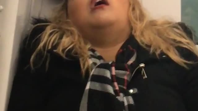 Blonde girl in minnie mouse ears asleep in back of train