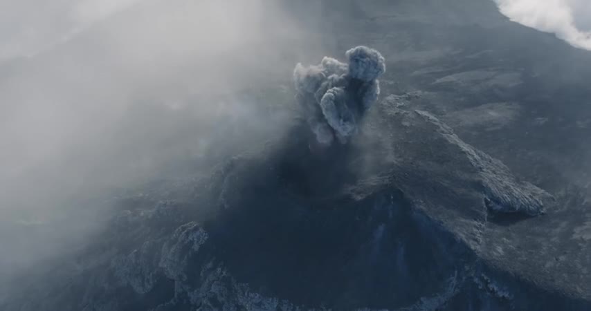 The drone contains incredible footage of a man rushing towards the opening of the volcano