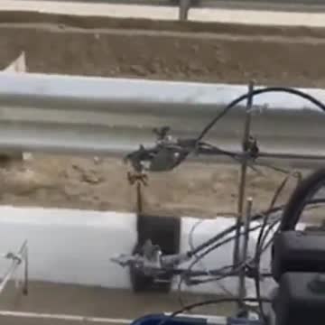 Painting the curb on the highway
