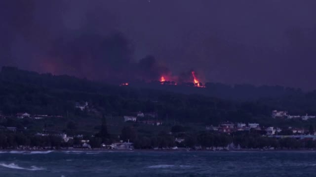 Greek firefighters battle overnight to contain blaze