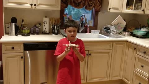 Spencer presenting a plane he built VID 20180730 185254