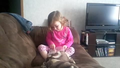 Emma reads to her mom
