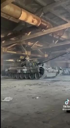 Ukrainian tanks displaying battle insignia of the German Nazi third Reich.