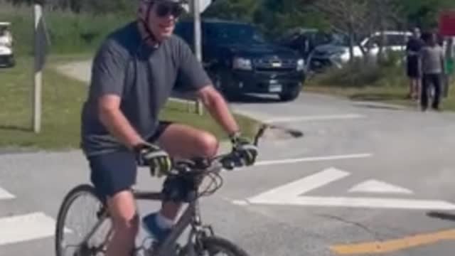 WATCH: Joe Biden collides with his bicycle