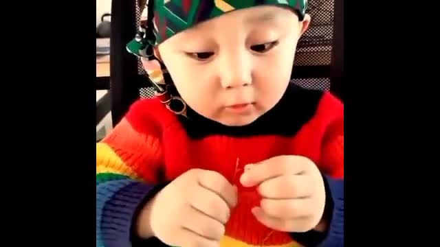 Boy Trying To Pass The Rope Through A Pinhole. He couldn't.