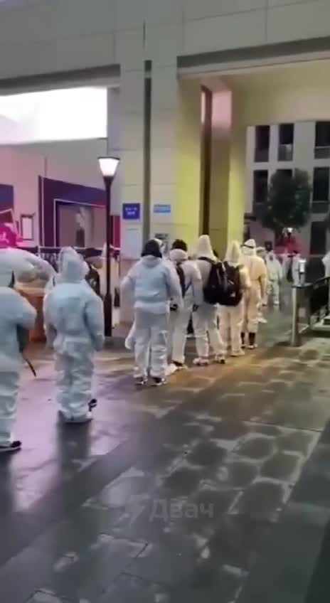 China - High school students go to class in protective suits