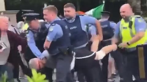 Garda carrying concerned locals away in Ballybrack...