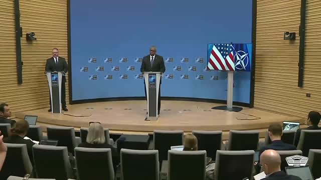 Secretary of Defense Lloyd J. Austin III speaks to the news media at NATO headquarters in Brussels.