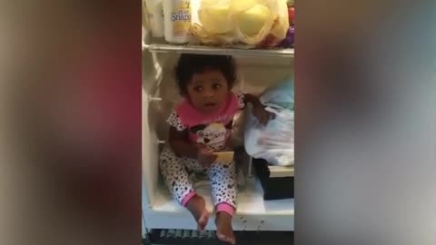 baby finds comfort in the refrigerator