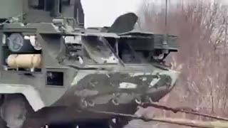 Ukrainian Farmer Hauls Away Abandoned Tank with Tractor