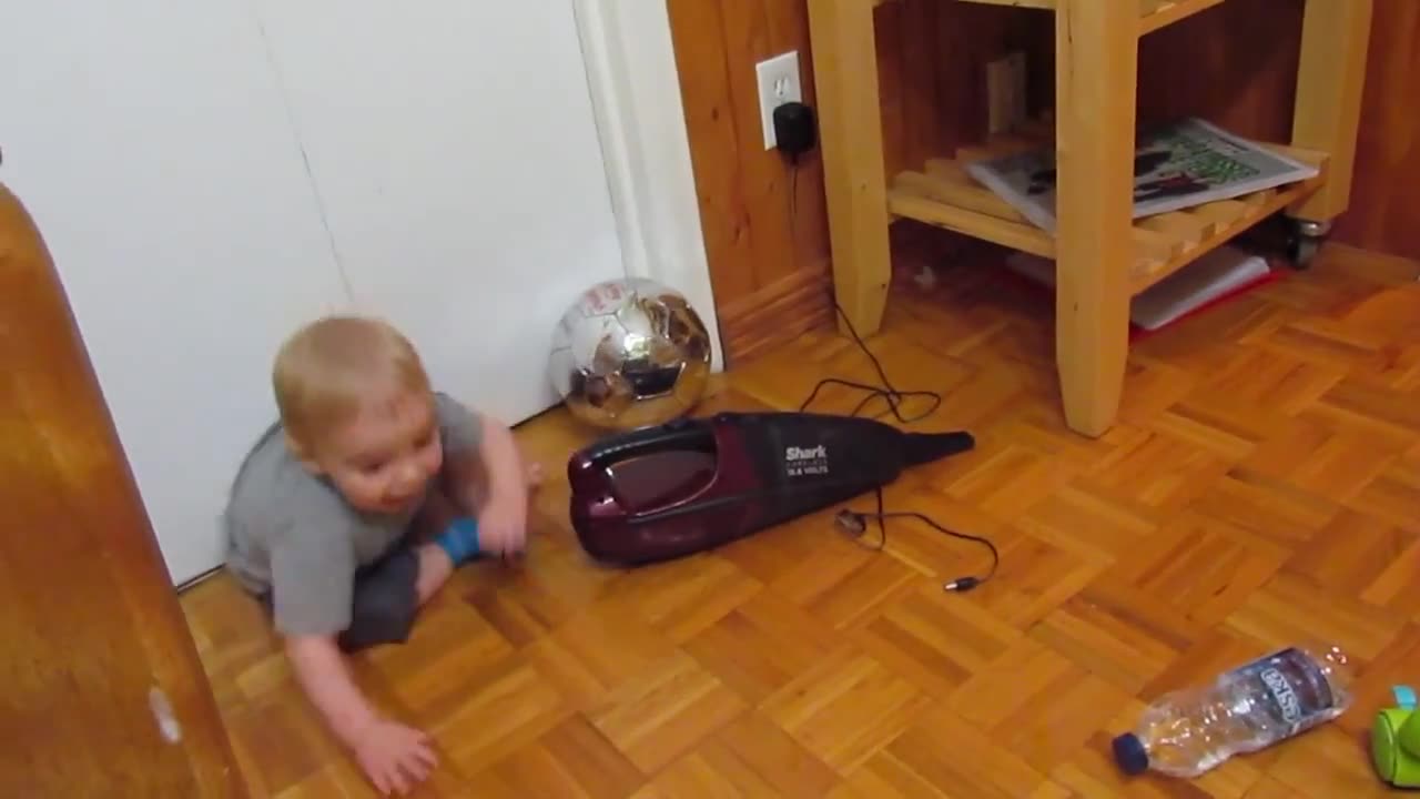 Baby Plays With Dustbuster, Freaks Out When It Turns On