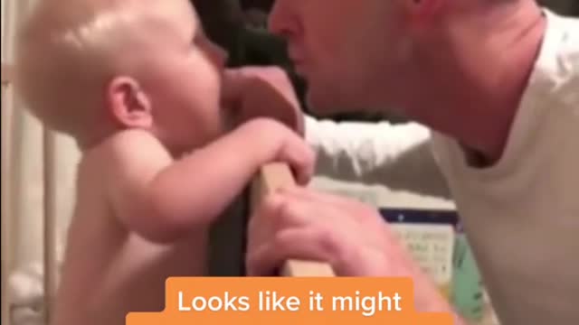 Baby Theo, who is just 11-months-old, was playing peekaboo with his dad, when