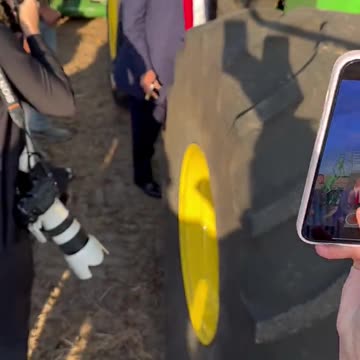 President Donald Trump signs a farmer's tractor!