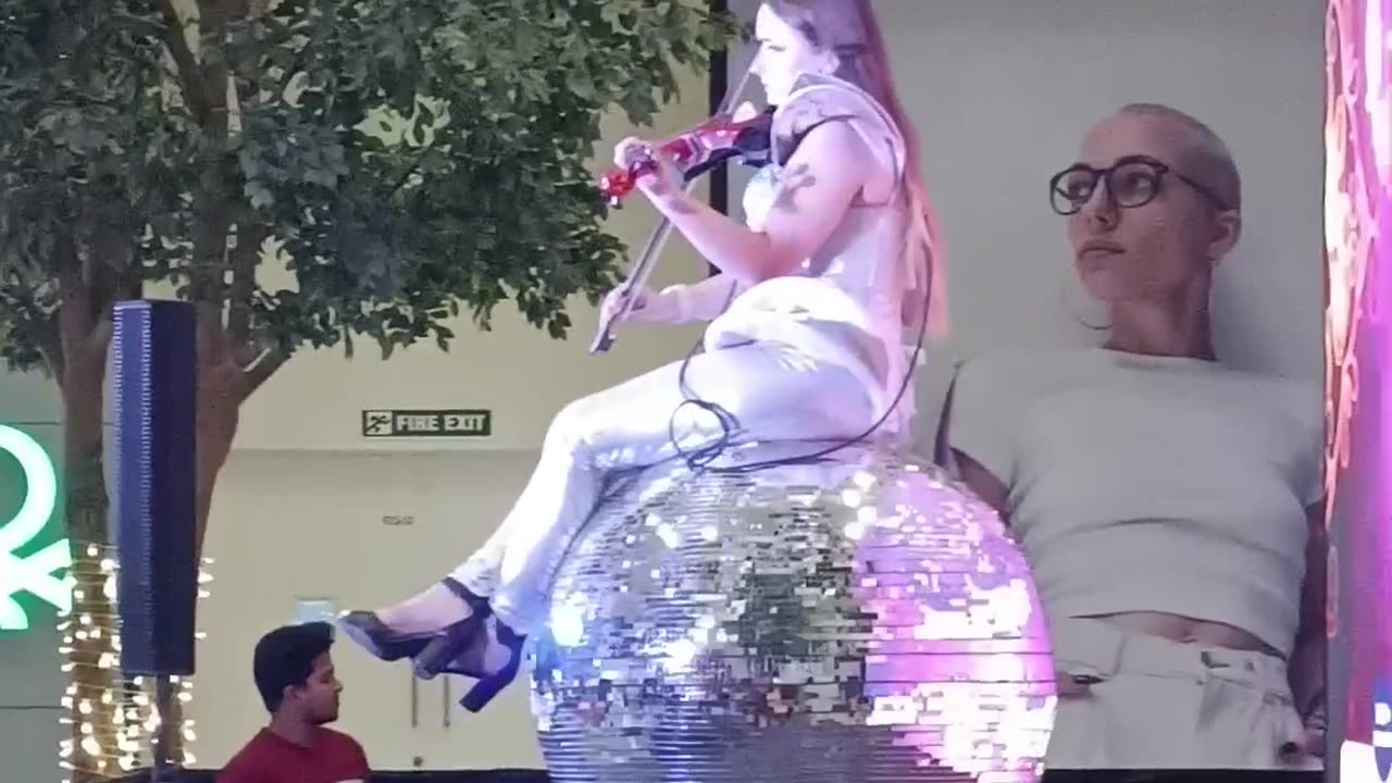 Beautiful french girl Performing guitar music show in placeo Mall Lucknow