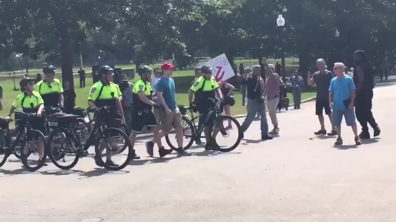 Aug 19 2017 Boston free speech rally 1.0 police escort man to vehicle after he was attacked by Antifa