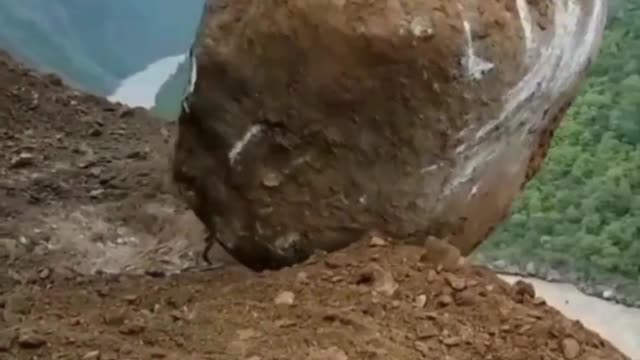 A Big Stone Dropped Into River with crane