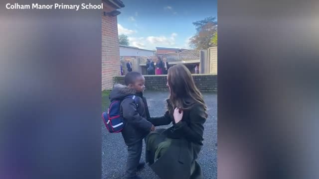 Moment Princess Kate gives adorable toddler her pinned poppy during school visit