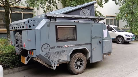 A weather-beaten caravan, njstar rv, with a muddy smell, a lot of off road