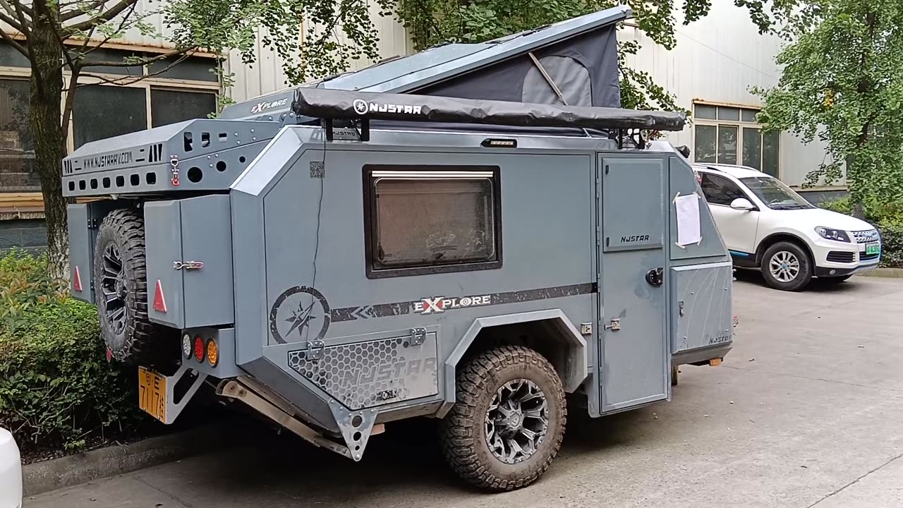 A weather-beaten caravan, njstar rv, with a muddy smell, a lot of off road