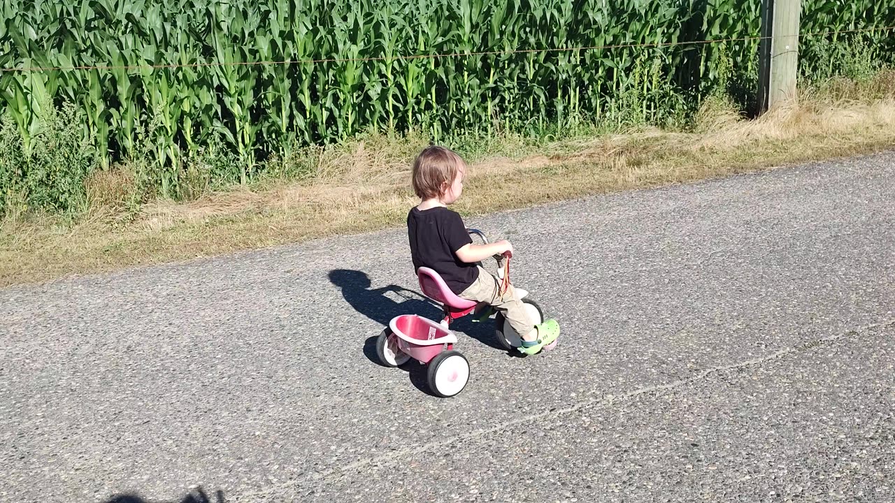 Kid rides a trike!