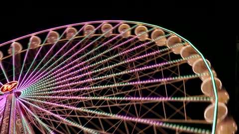 Colorful Ferris Wheel in Motion