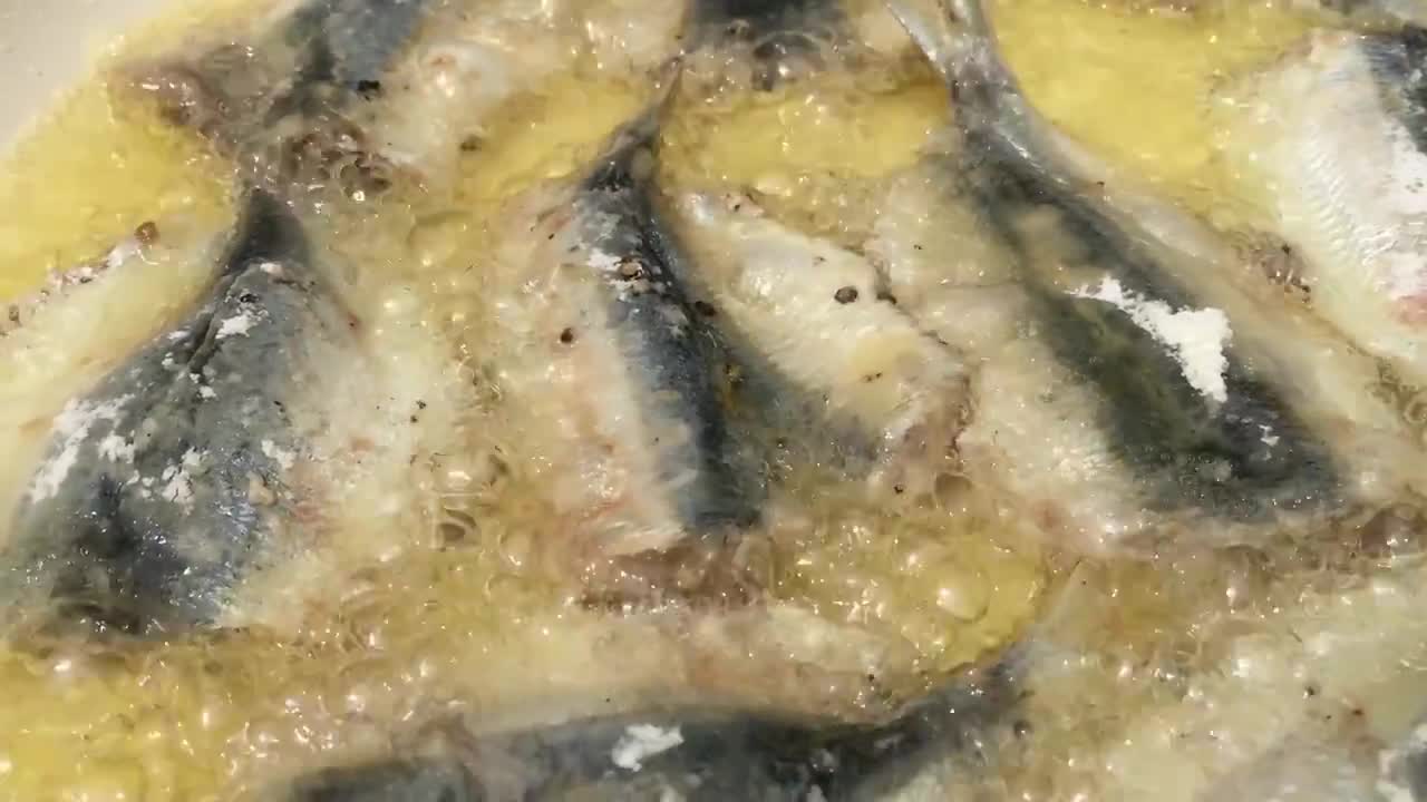 Clean and cook tamban (bait fish)