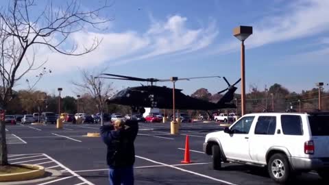 Uh-60 landing in parking lot