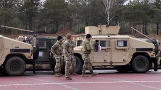 Humvees, U.S. troops land in Poland