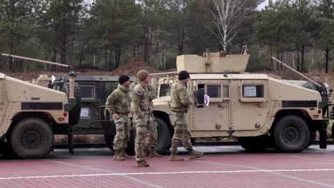Humvees, U.S. troops land in Poland
