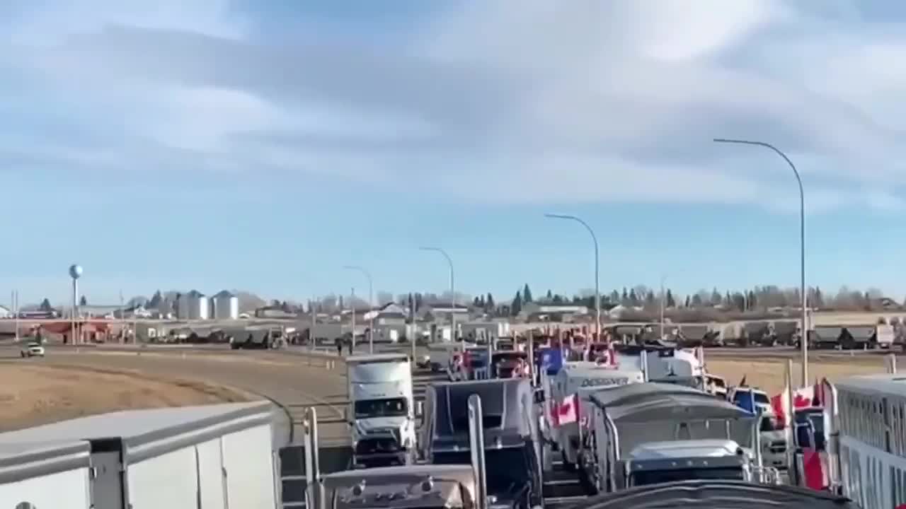 Massive convoy of truckers have blockaded the US-Canada border crossing in Alberta.