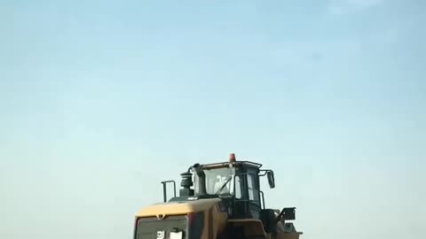 Lowboy Trailer Action: Transporting a Colossal Wheel Loader!🚛💥