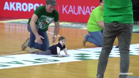 The father encourages the baby to cheer