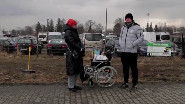 Ukraine refugees arrive at Polish camp